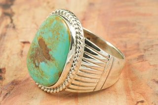 Genuine Manassa Turquoise set in Sterling Silver Ring. This Turquoise is also referred to as King�s Manassa Turquoise. The Manassa Turquoise mine is located in Manassa, Conejos County, Colorado. Created by Navajo Artist Phillip Sanchez. Signed. 